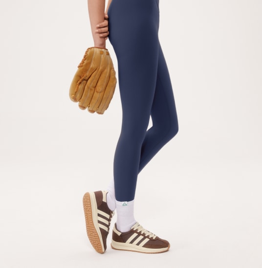 woman wearing brown adidas shoes