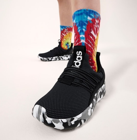 Black and white adidas tennis shoes