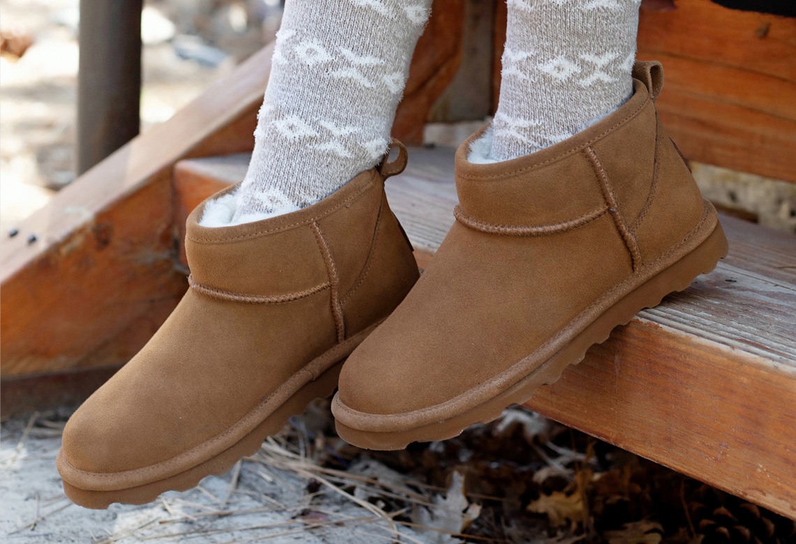 feet of person wearing brown bearpaw short cozy boots 