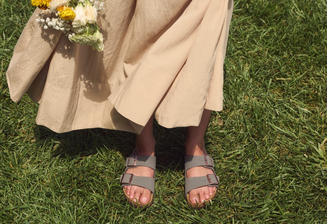 Birkenstock sandals in a field of grass