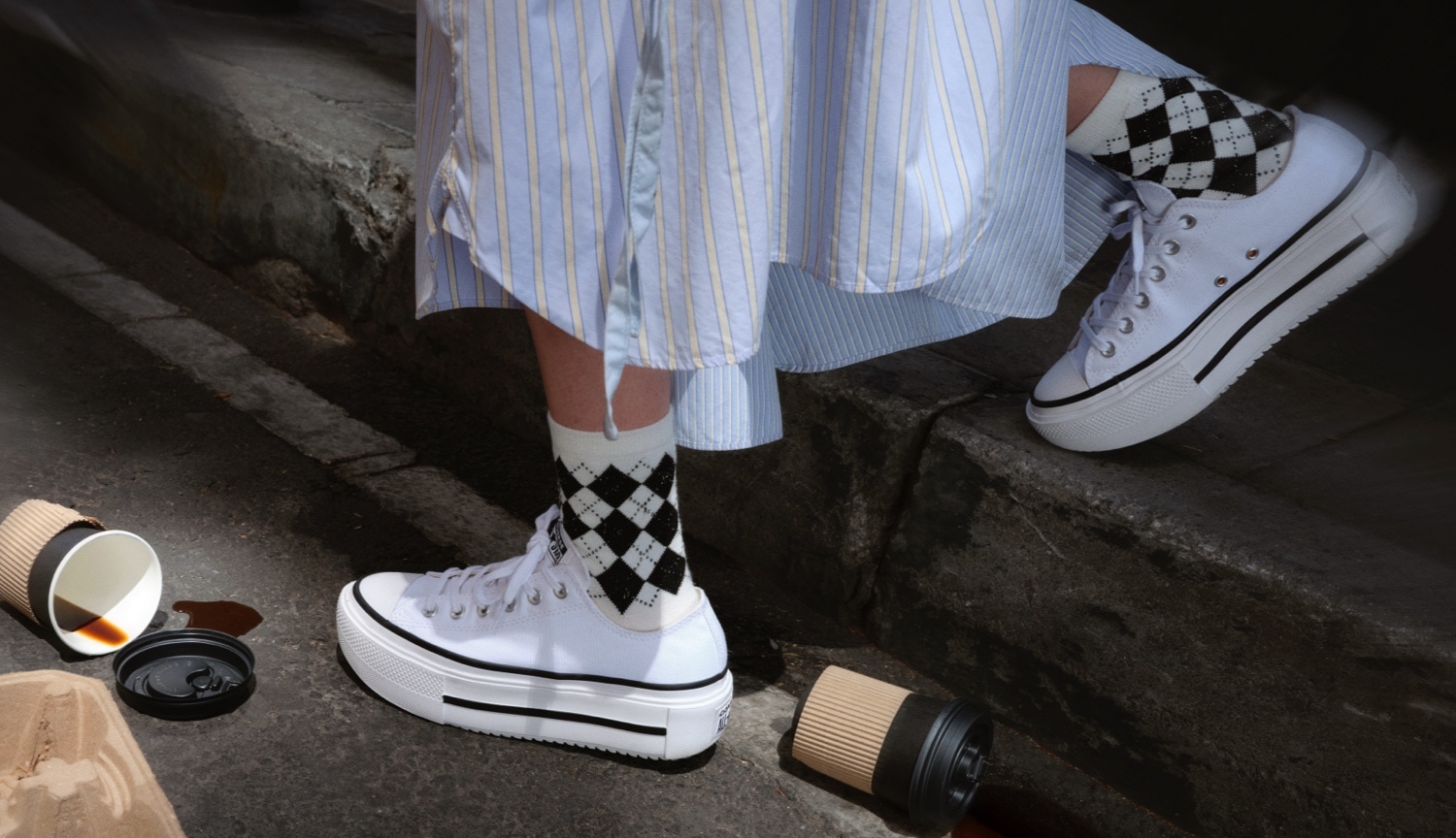 woman wearing converse platform sneakers in white