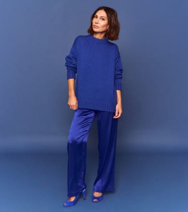 woman in royal blue outfit with matching heels