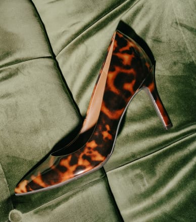 tortoiseshell high heel on green velvet furniture
