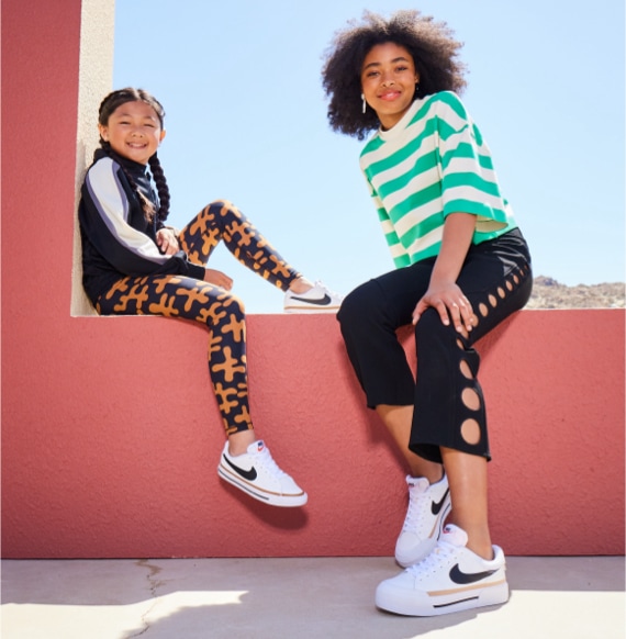 mom and daughter wearing nike court sneakers