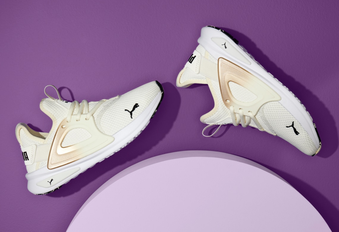white puma sport sneakers with hombre accents