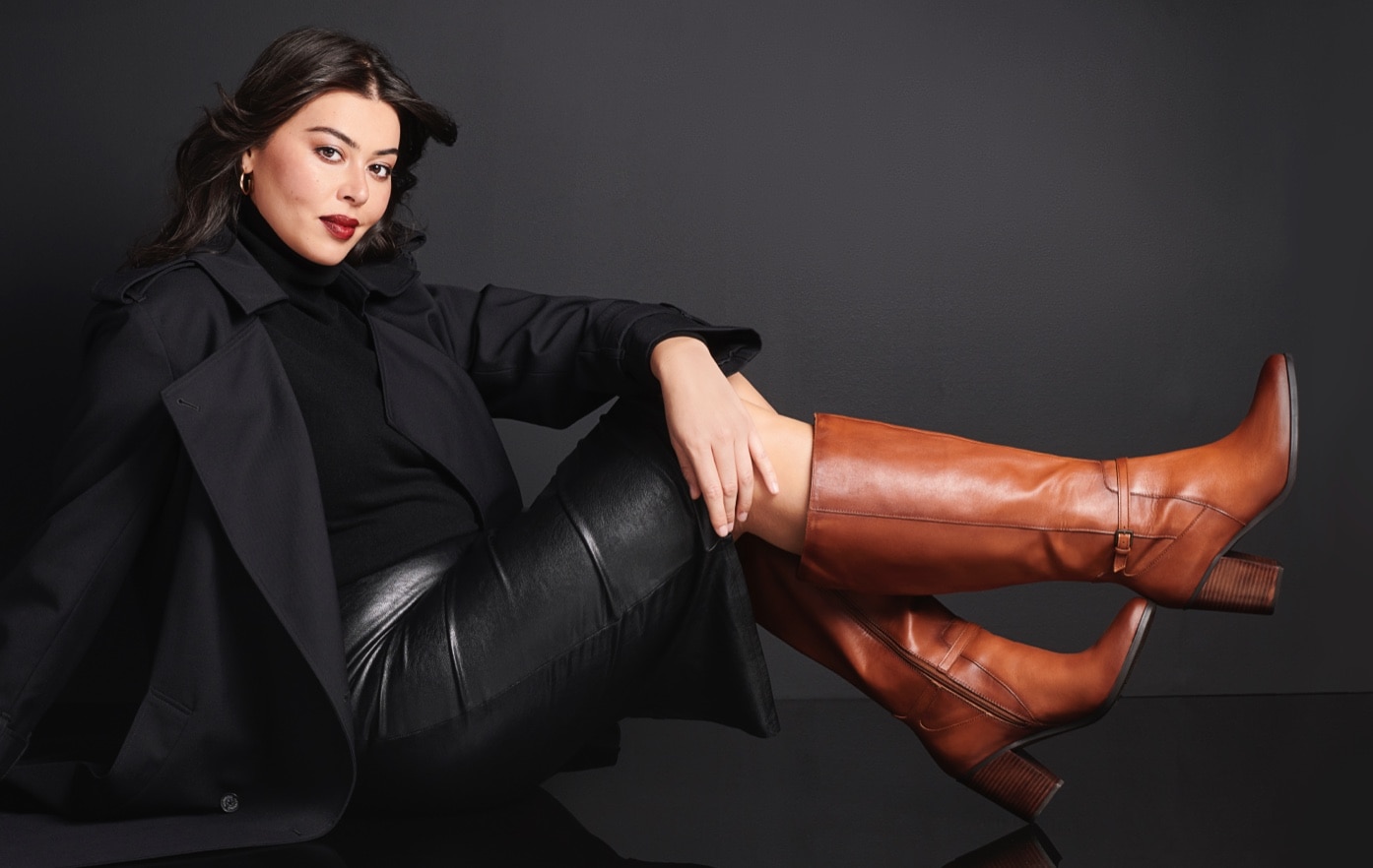 Woman wearing brown knee high boots