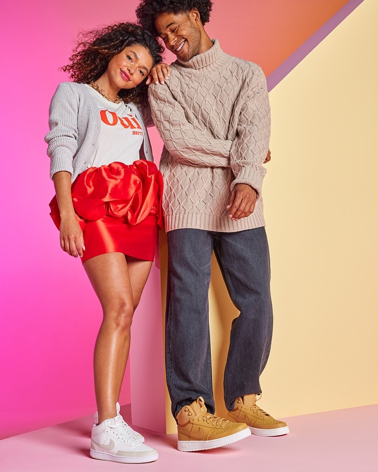 man and woman wearing court sneakers