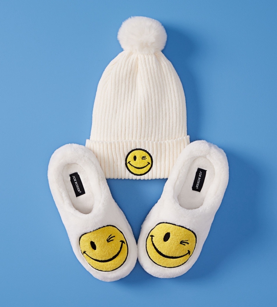 matching hat and slippers with smiley faces on them