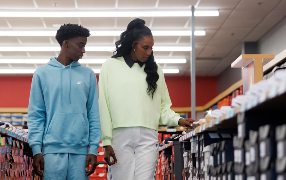 Lisa Leslie and son shopping in a Famous Footwear store