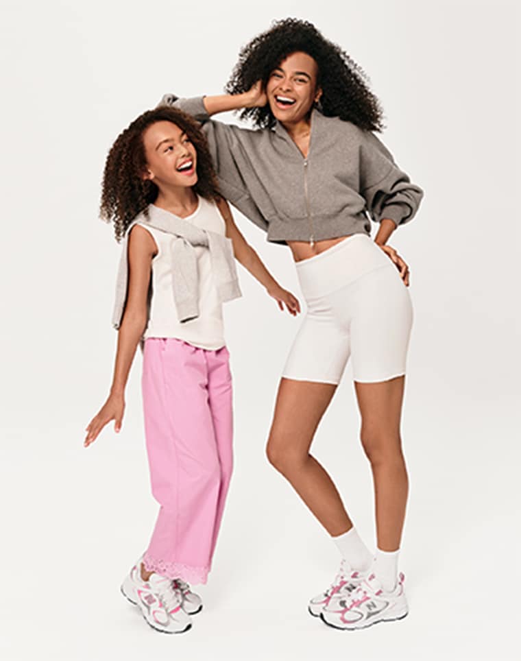 two girls wearing new balance