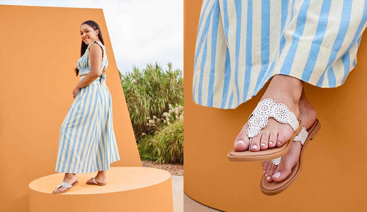 Woman wearing striped dress with white fashion flat sandals