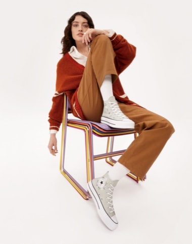 woman wearing Converse platform sneakers