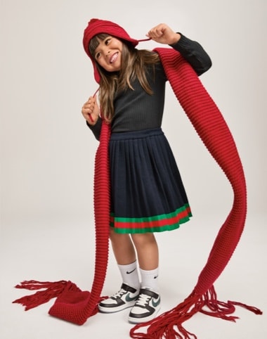 girl wearing nike court sneakers