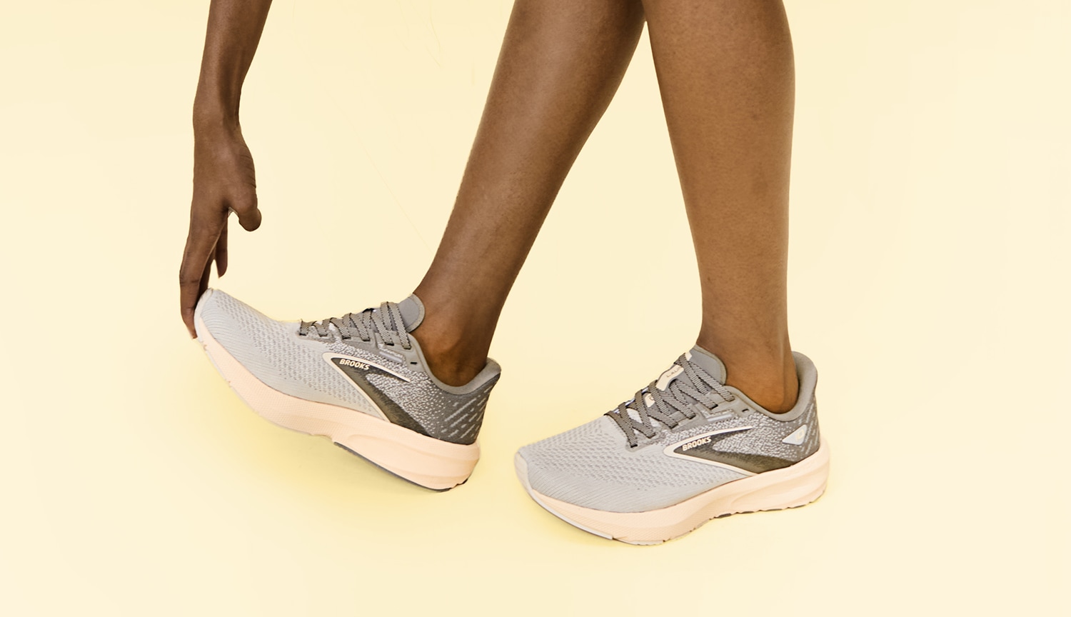 Brooks running shoes in grey and orange