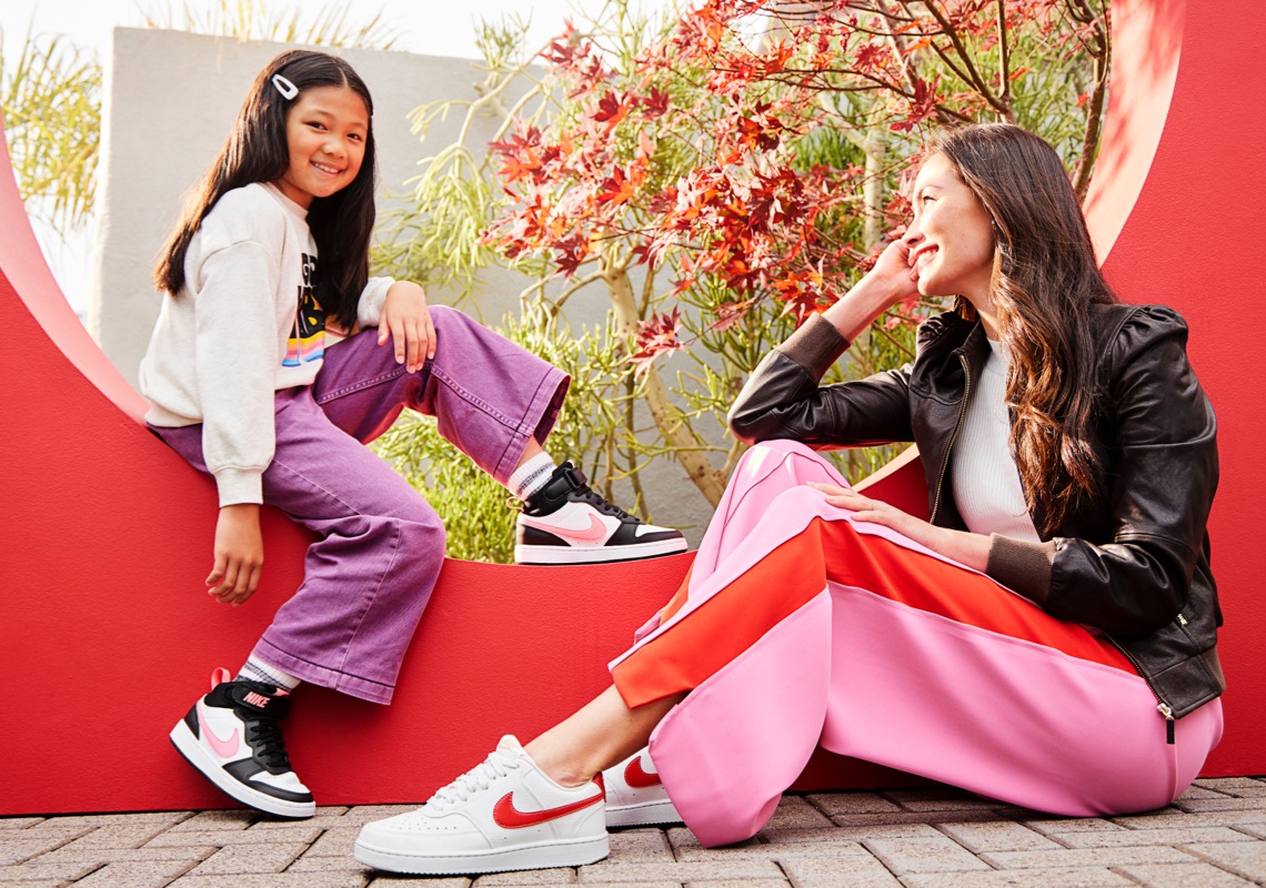 a woman and a little girl wearing nike sneakers