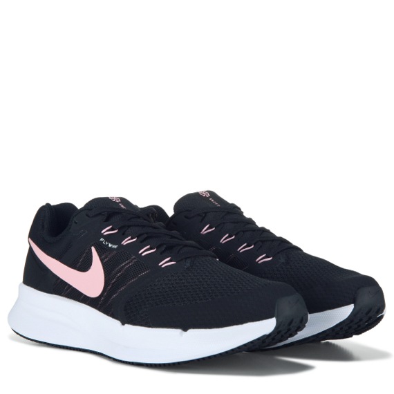 black nike running shoes with light pink accents
