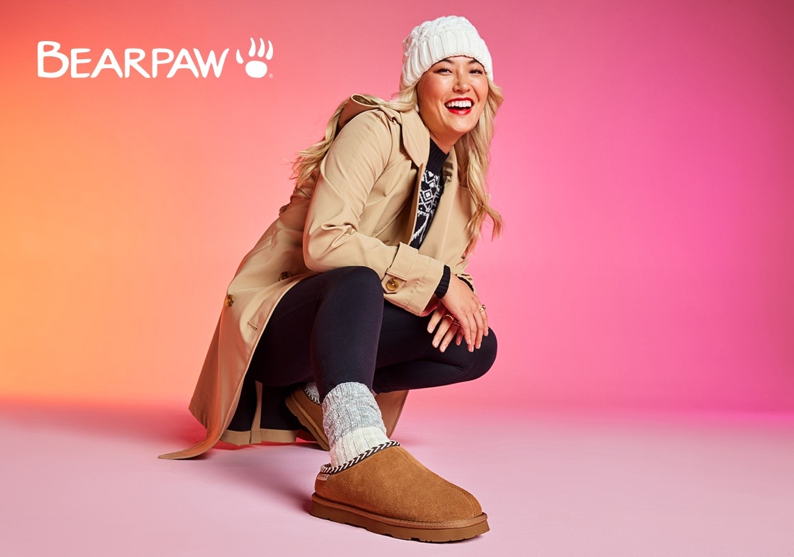 woman wearing cozy bearpaw slippers and socks