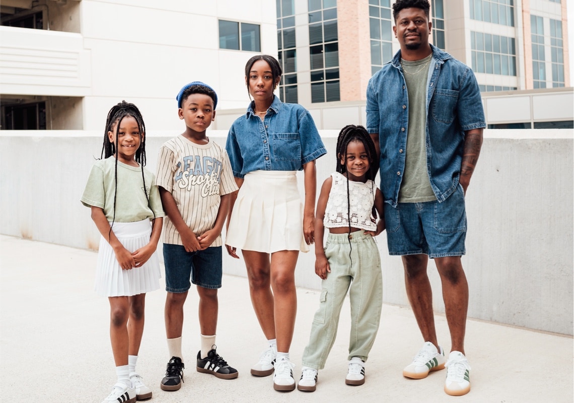 shay, her husband and three kids wearing adidas court sneakers