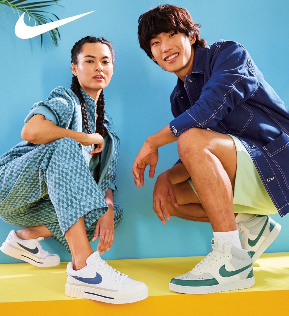 man and woman kneeling down wearing nike court sneakers