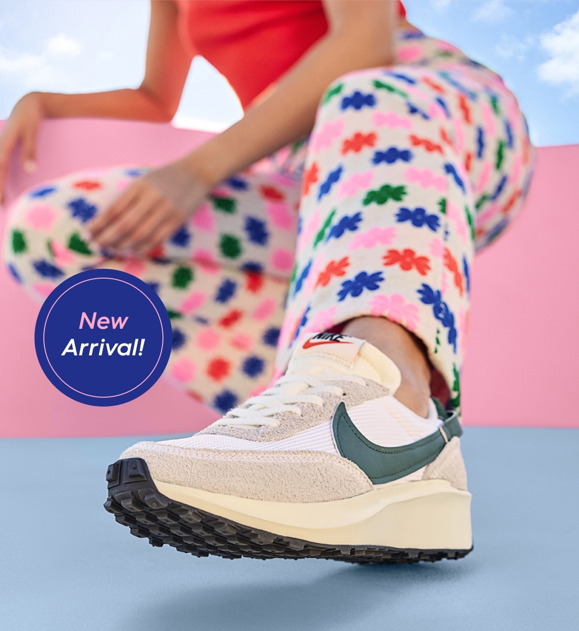 new arrival! legs of woman in floral pants wearing women's nike waffle debut retro sneaker