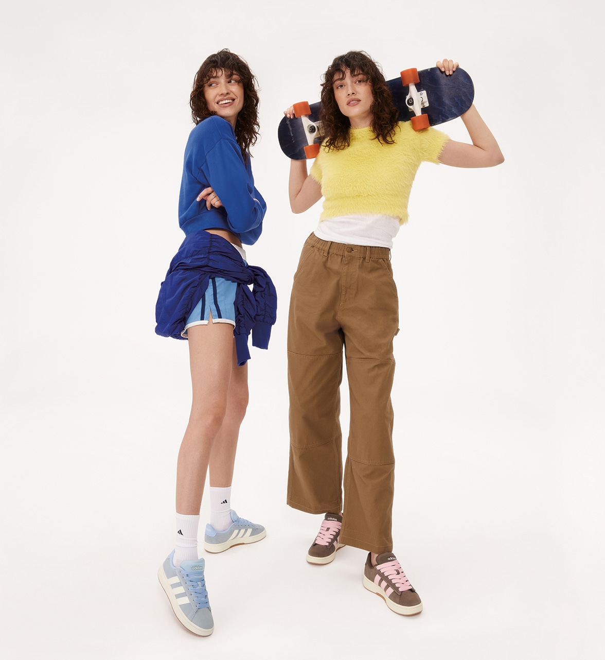 two women wearing skate sneakers