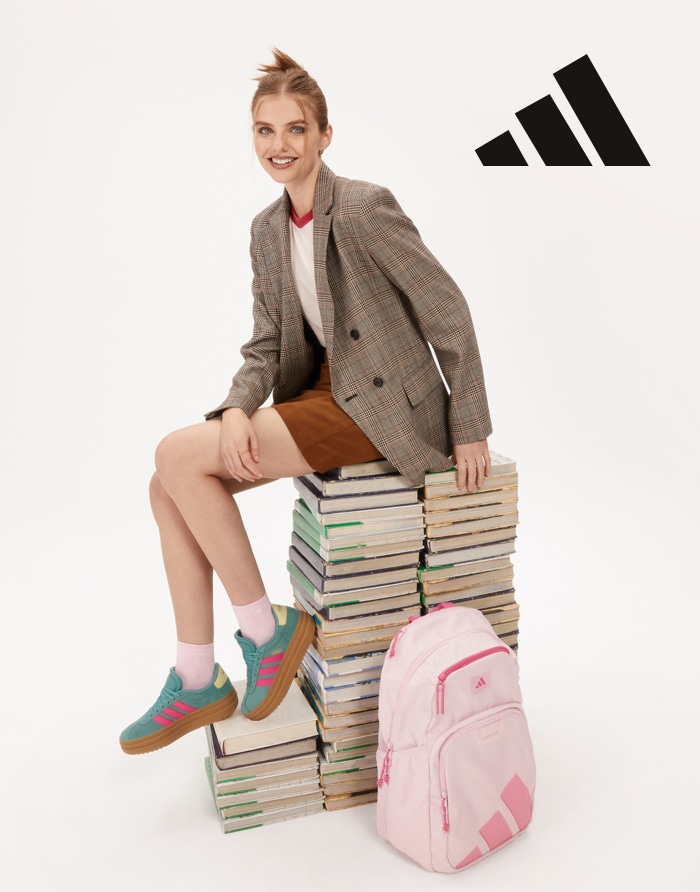 woman wearing adidas sneakers