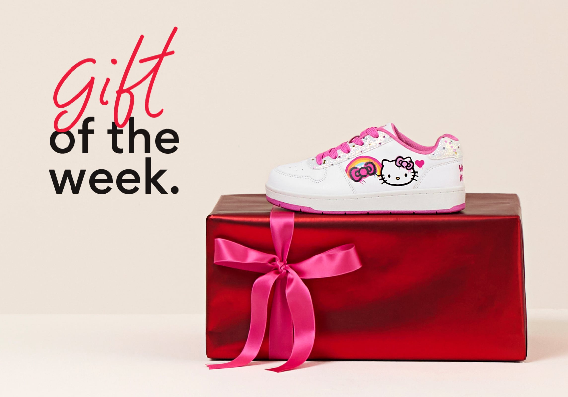gift of the week showing a hello kitty sneaker on top of gift boxes