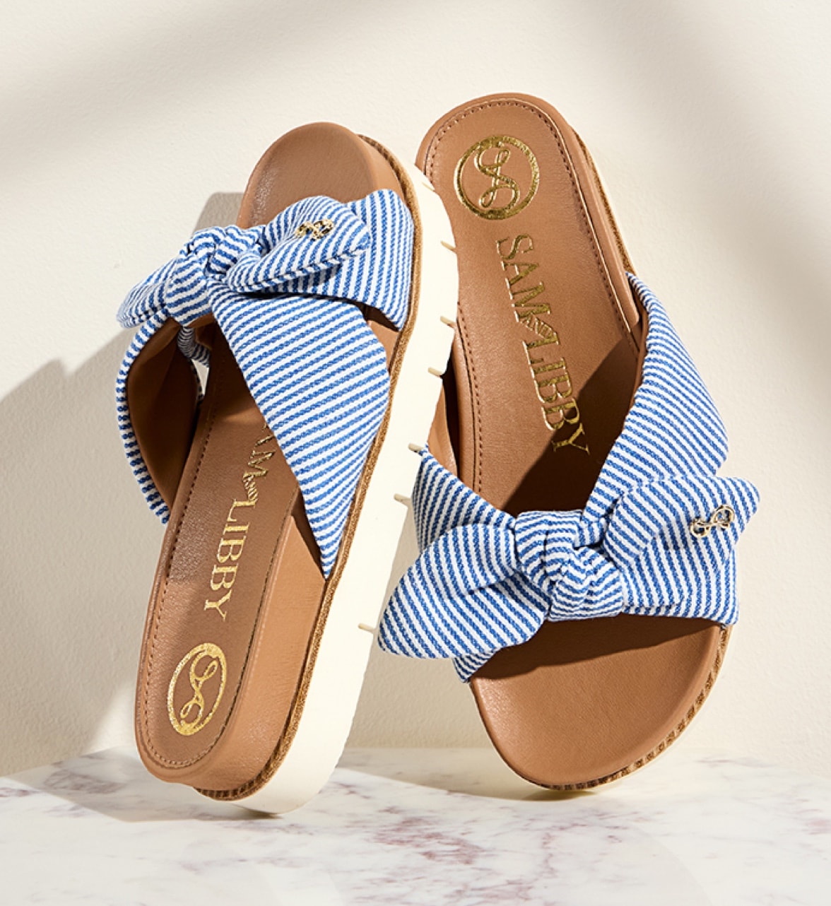 blue and white striped sam and libby astrid sandals with bows