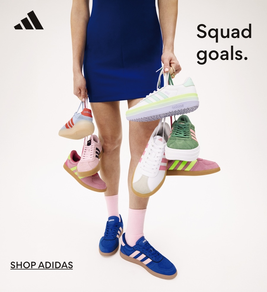 legs of person in navy blue skirt wearing and hilding adidas court sneakers by strings. squad goals. shop adidas. 