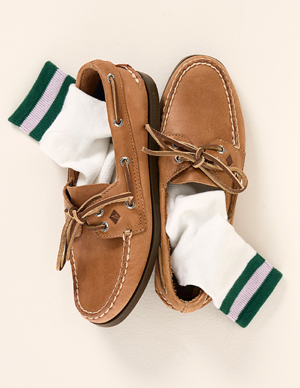 pair of sperry shoes with socks inside them
