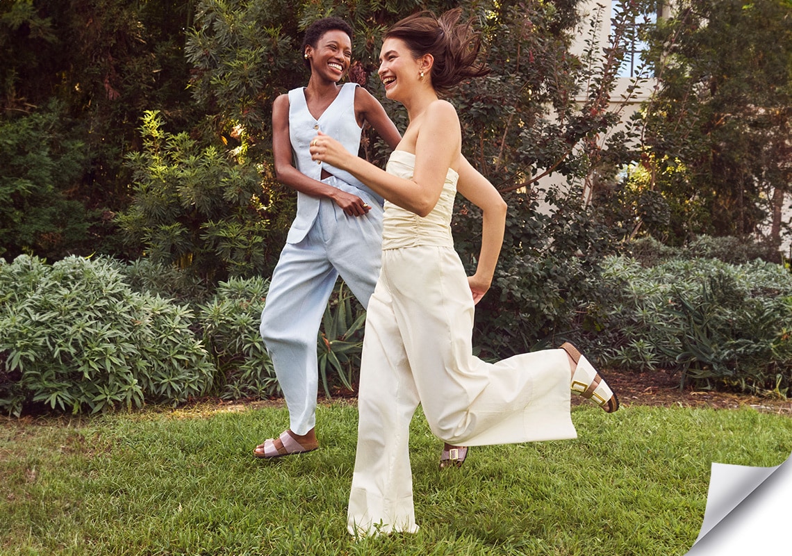 women running in a yard wearing birkenstock sandals