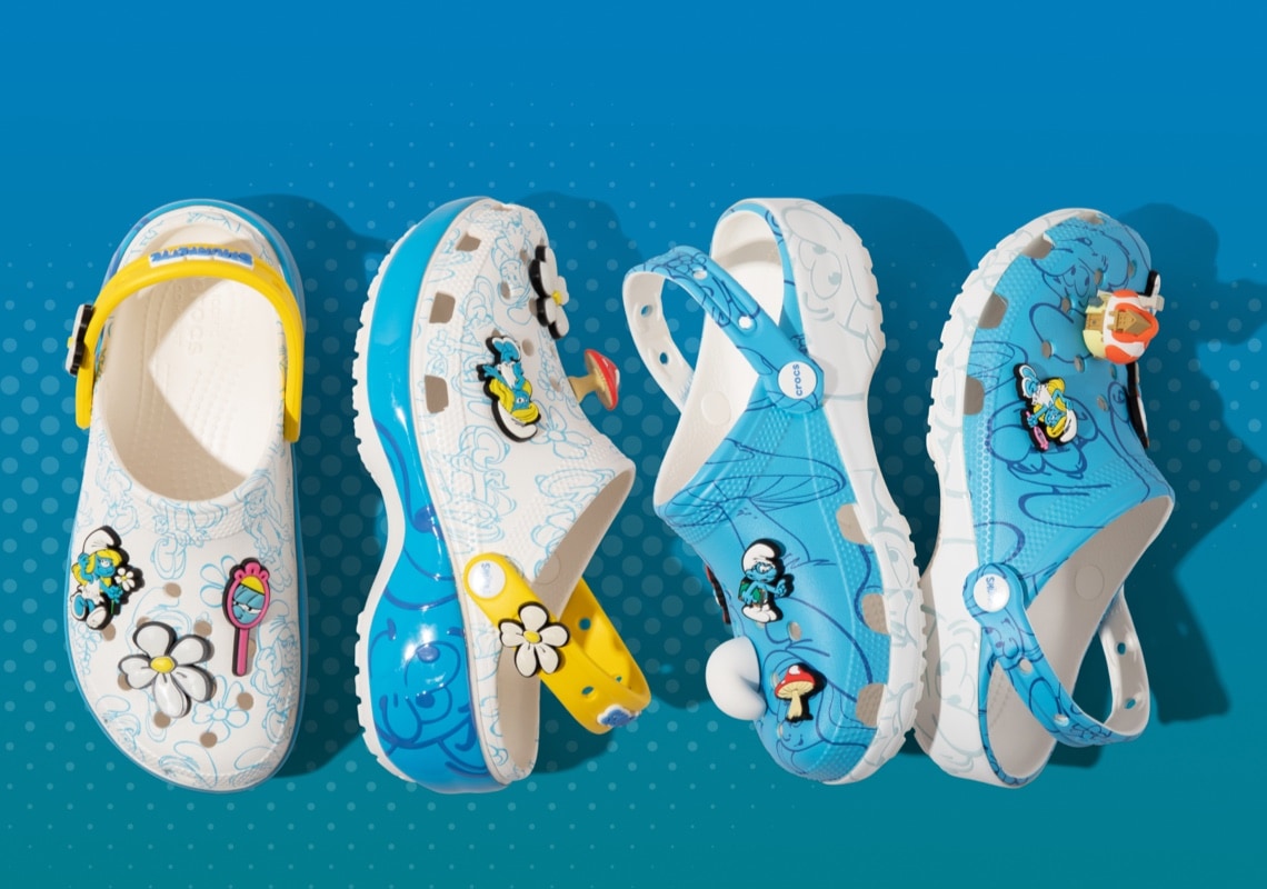 white and blue Smurfs crocs with Smufs designs