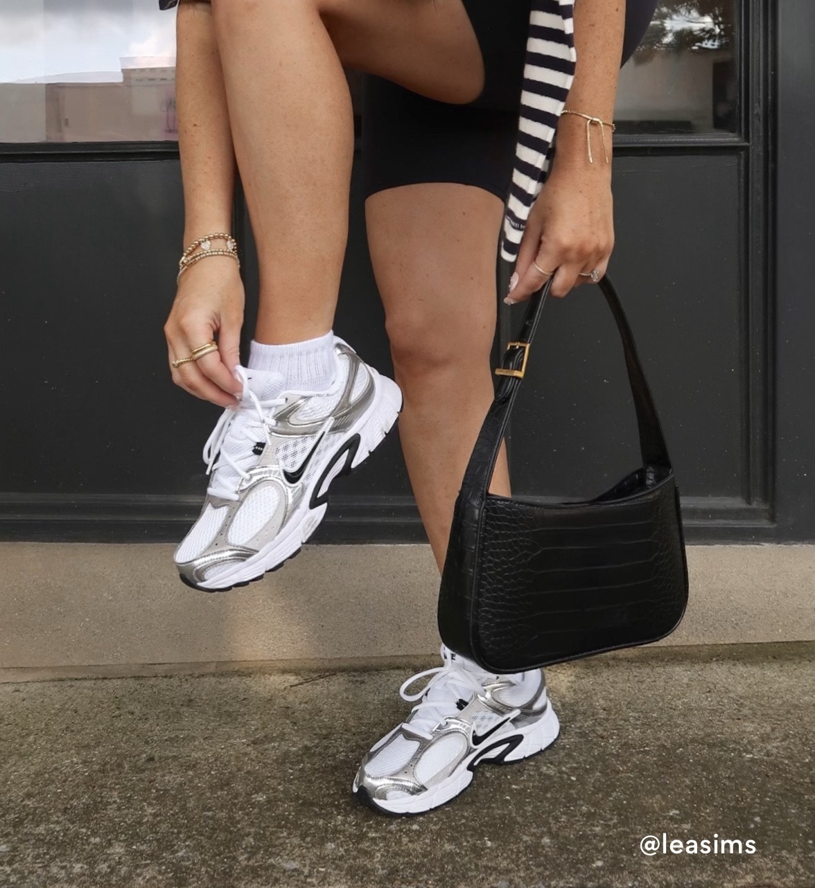 Nike Shoe with a black purse 