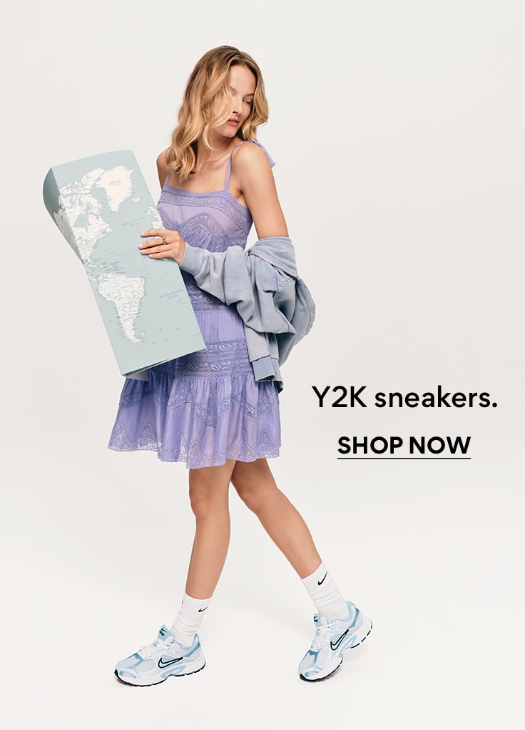 woman in checkered two piece set wearing white sneakers