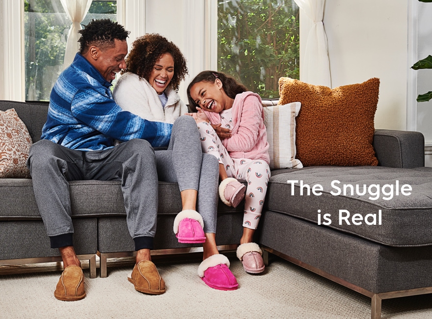 Family wearing slippers while sitting on a couch