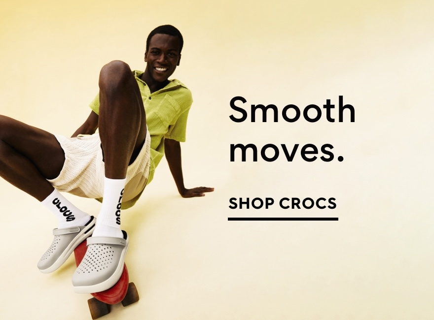 Man on skateboard wearing Crocs. Shop Crocs
