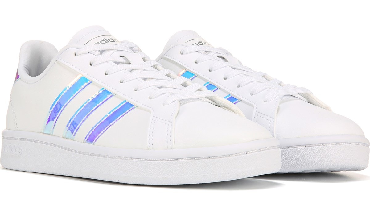 white adidas with iridescent stripes