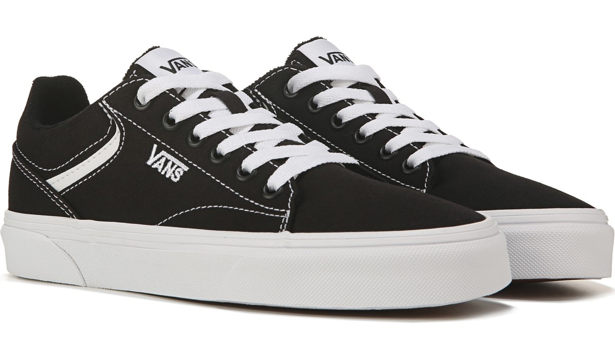 white and black low top vans