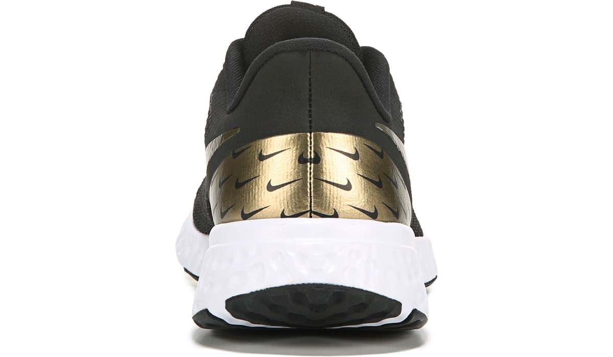 nike black and gold shoes