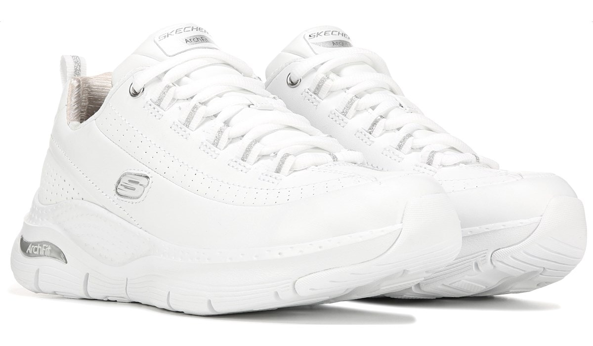 white sketcher tennis shoes